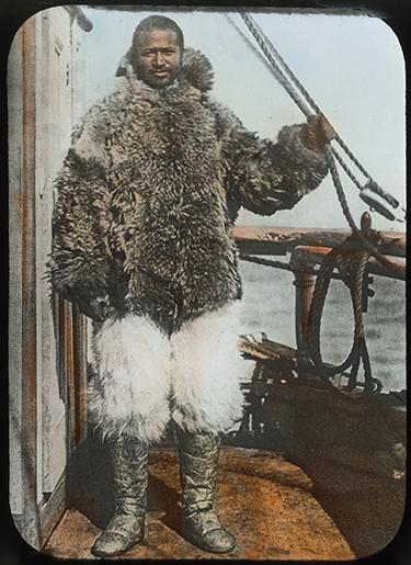 Donald B. MacMillan, Matthew A. Henson in furs on the deck of the Roosevelt.